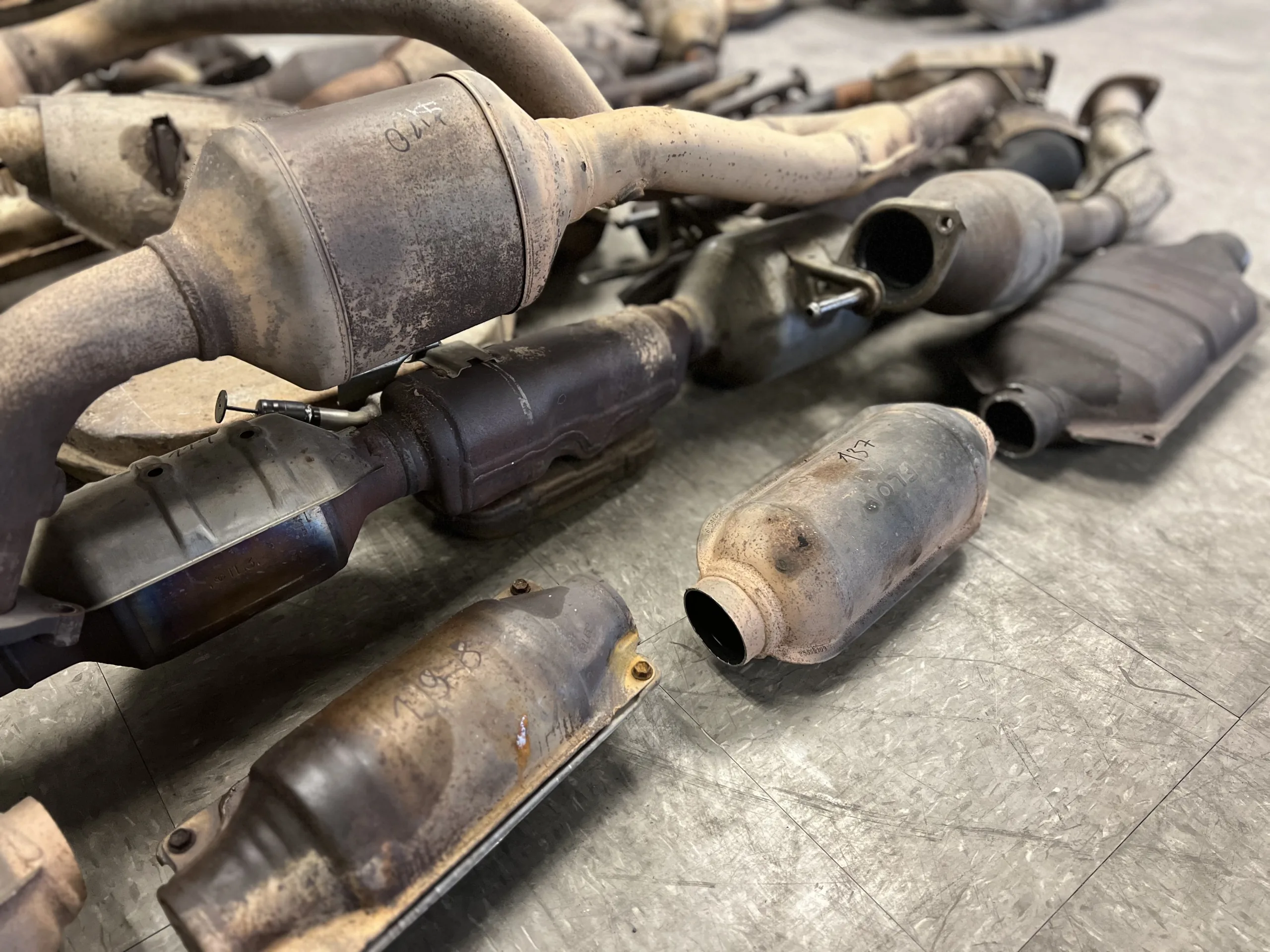 Assorted used catalytic converters collected for scrap recycling